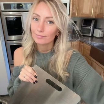 Emily with her Katori cutting board in the kitchen